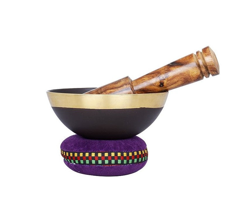 Brass yoni singing bowl with purple base cushion and wooden handle, 4 cm height