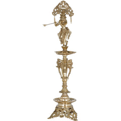 Brass Krishna diya lamp with detailed standing deity and layered circular trays