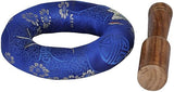 Blue patterned cushion with wooden singing-bowl mallet