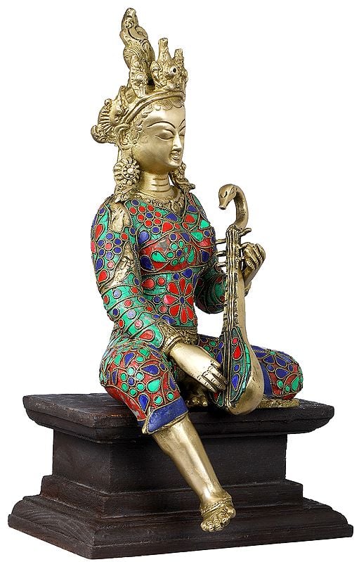 Handmade Devi Saraswati Seated on Wooden Pedestal in Brass 14 inches