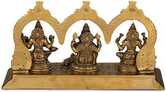Brass Lakshmi, Ganesha & Saraswati Maa figures in perforated arch frame
