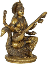AONA brass Saraswati sculpture playing veena on ornate lotus pedestal