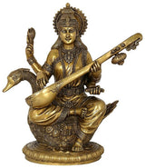Brass Saraswati goddess sculpture holding veena and sitting on lotus base