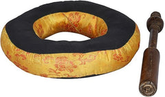 Golden patterned cushion and wooden striker with brass tip for singing bowl