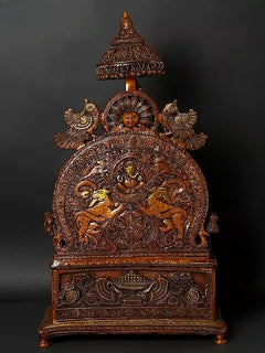 Brass back panel sculpture with carved mythic figures, domed canopy and pedestal base