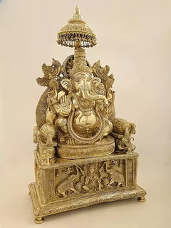 Brass Ganesha statue with Gaja Lakshmi, detailed crown and seated pose
