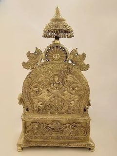 Brass ornate pedestal sculpture featuring Gaja Lakshmi scene, back view