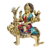Brass Durga idol on lion, red/blue beaded detailing, raised arms with trident and tools