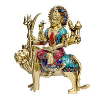 Brass Durga idol on lion, red/blue beaded detailing, raised arms with trident and tools