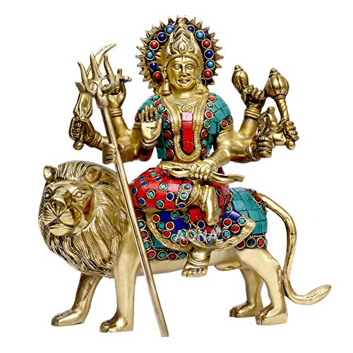 Brass Durga idol on lion, blue/red gemstone inlay, four arms holding trident and tools