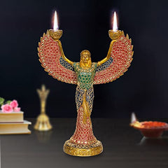 Brass ISIS goddess candle holder with two lit candles, 12-inch winged statue