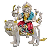 Silver lion statue with seated deity holding objects, teal and red jewelry, 5 in