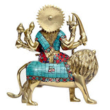 Brass Durga idol riding lion, teal dress with jeweled borders, sunburst back