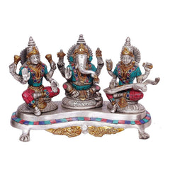 Brass Ganesh-Lakshmi-Saraswati statue trio with jeweled detailing on round base