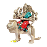 Durga figurine on lion, side view; detailed face, armor with turquoise/red tiles